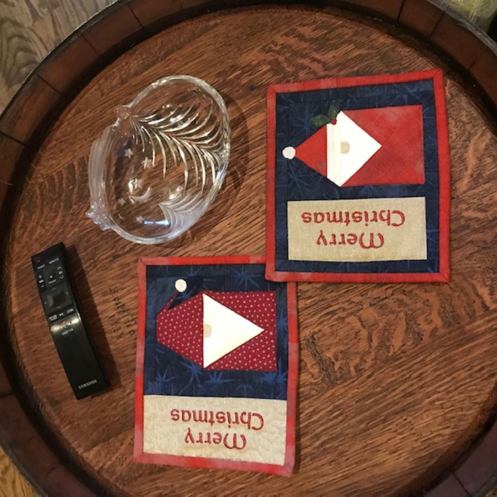 Nome mug rugs on table.