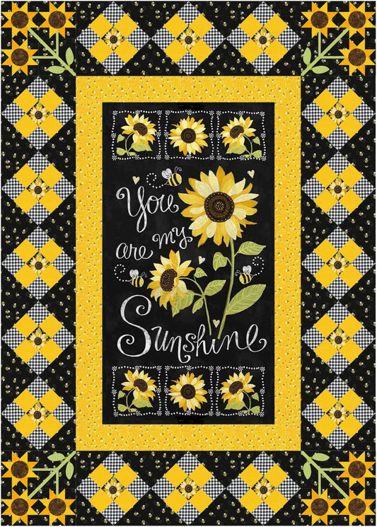 This panel surround features the "You Are My Sunshine" fabric panel  surrounded by fussy cut sunflowers in nine patch squares set on diagonal.  Corner squares with fusible applique sunflowers add to the charm of this quilt surround